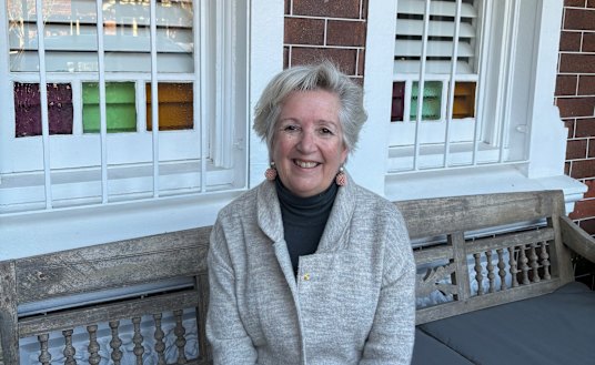 Jane Caro on the front porch of her new (old) house.