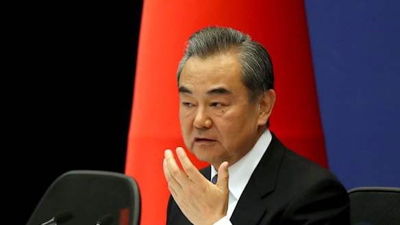 Chinese Foreign Minister Wang Yi at the announcement.