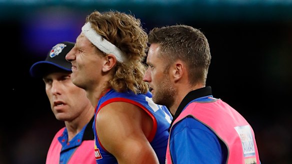 Aaron Naughton in pain from a knock to the calf.