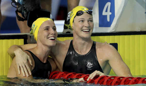 Australia's Cate Campbell, right, embraces her sister Bronte after their women's 50m freestyle semi at the 2018 Commonwealth Games.