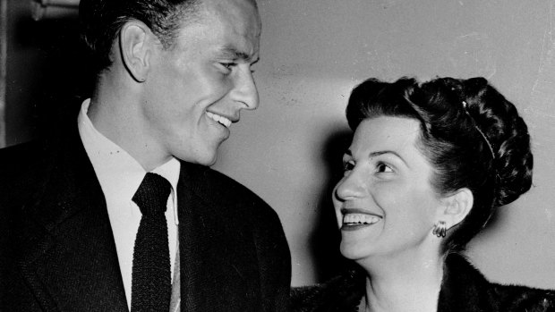 Frank and Nancy Sinatra smile broadly as they leave a Hollywood nightclub in 1946.