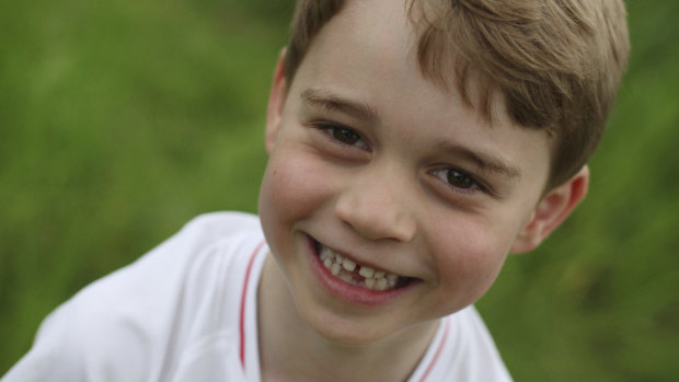 Britain's Prince George poses for a photo taken by his mother, Kate, the Duchess of Cambridge, in the garden of their home at Kensington Palace, London.