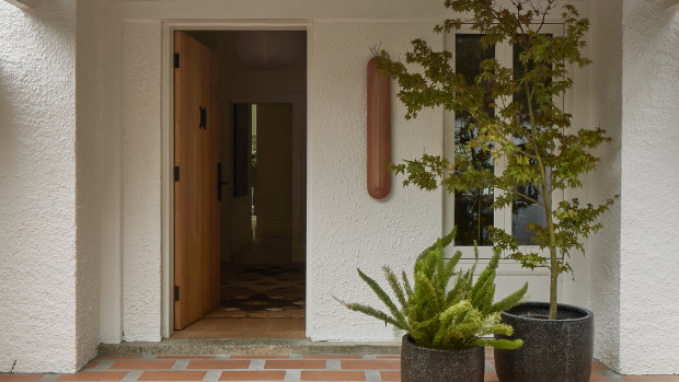 One of the small incremental changes made was to the threshold between the entrance and the front living area.