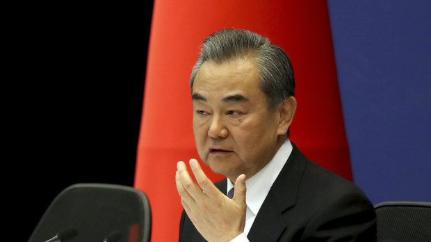 Chinese Foreign Minister Wang Yi at the announcement.