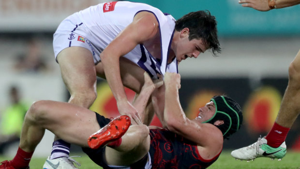 Andrew Brayshaw clashes with brother Angus during a match last year.