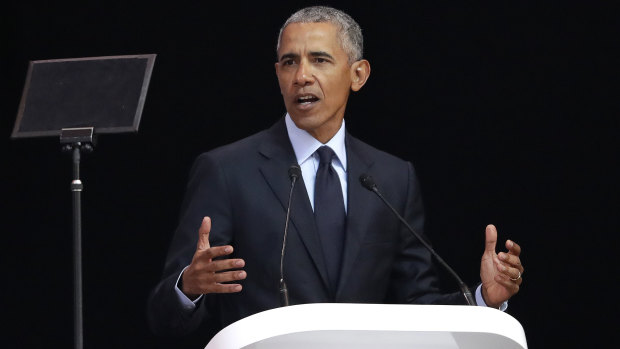 Barack Obama delivers the 16th annual Nelson Mandela Lecture at the Wanderers Stadium in Johannesburg.