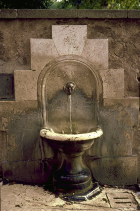 Tourists can fill up their water bottles at one of Rome’s famous nasoni drinking fountains.
