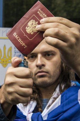 Fomin burns his Russian passport in protest at the invasion of Ukraine.