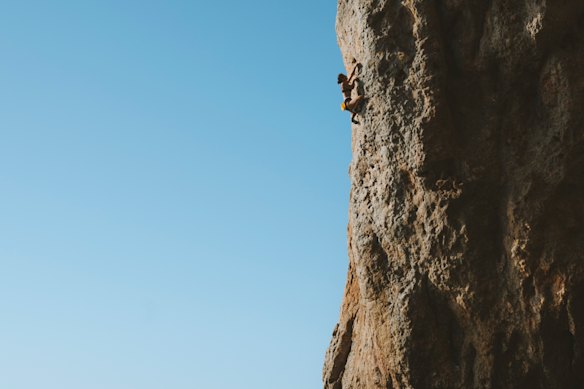 Australian climber Angie Scarth-Johnson doing deep water soloing. 