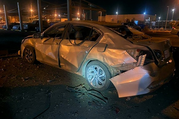 A damaged car is parked at an Aramco terminal in the southern border town of Jizan, Saudi Arabia.