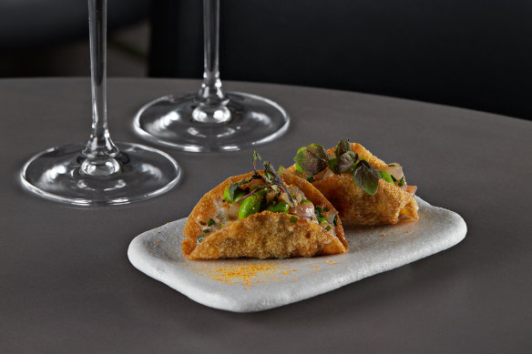 Duckfish tartare on wonton crisps.