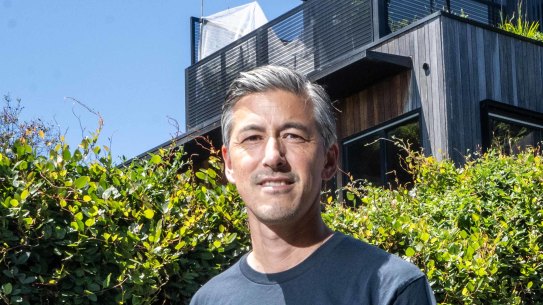 Tim Riley outside the home he built through a co-operative.