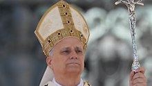 Pope Leo, seen giving mass at Easter, is not only head of the Catholic church, but he is also head of state and sovereign of the Vatican.