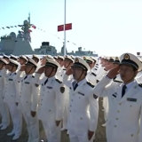 Sailors salute the Chinese President at the launch of the Shandong, China's first home-built aircraft carrier, on December 17, 2019.