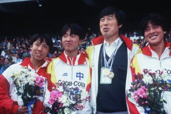 Discredited Chinese coach Ma Junren (third from left) in 1993 with Wang Junxia (second from left), Zhang Lirong (left) and Zhang Linli (right).  