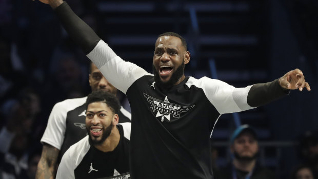 LeBron James celebrates a basket during the All-Star game.