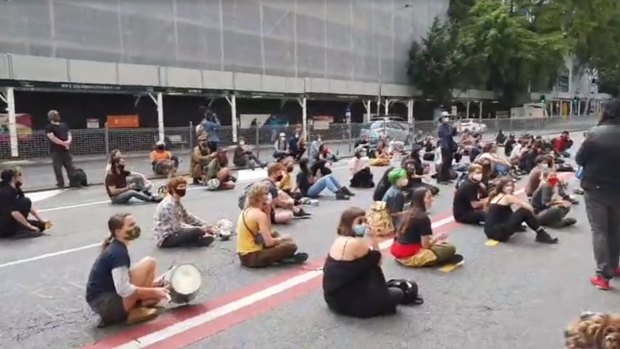 Black Lives Matter protesters descend on Queensland police headquarters in Brisbane on Friday.