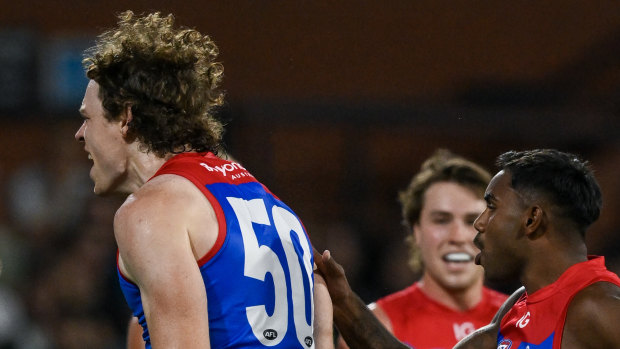 Ben Brown of the Demons  celebrates a goal.