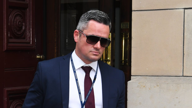 Detective Senior Constable Murray Gentner leaves the Supreme Court on Thursday.