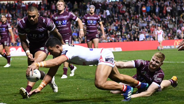 Tim Lafai reaches to score against Manly.