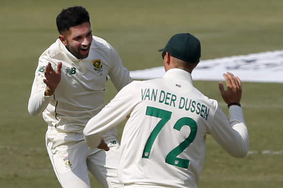 Keshav Maharaj, back, is just the second South African Test cricketer to take a hat-trick.