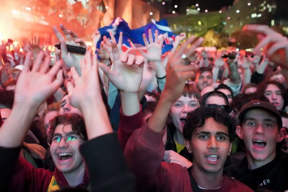 Melburnians celebrate in Federation Square on Thursday morning.