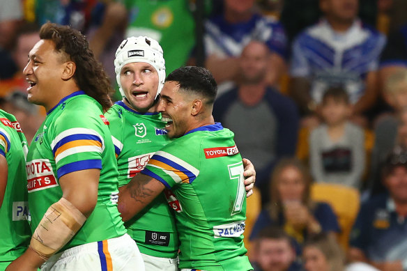 Jarrod Croker celebrates a try with Jamal Fogarty.