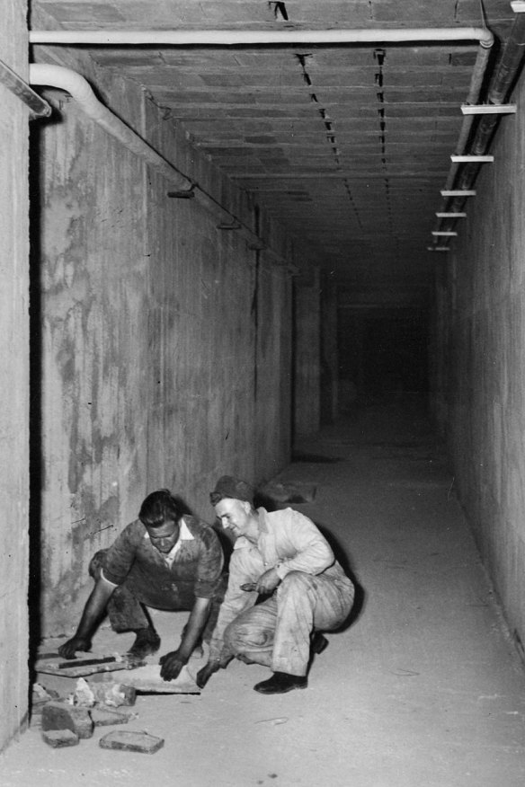 Workers in the tunnel beneath the Royal Melbourne Hospital pictured in 1940.