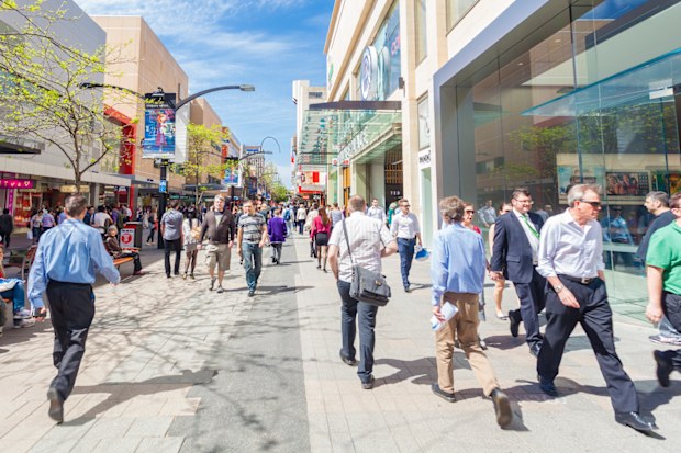 Adelaide, Australia - September 23, 2013: People walking along Rundle Mall in Adelaide, South Australia. Rundle Mall is the premier retail area of South Australia and a popular tourist attraction.