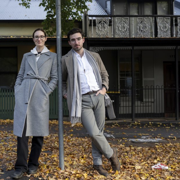 The YIMBY group’s Katie Roberts-Hull and Jonathan O’Brien in front of some terrace homes in Carlton.