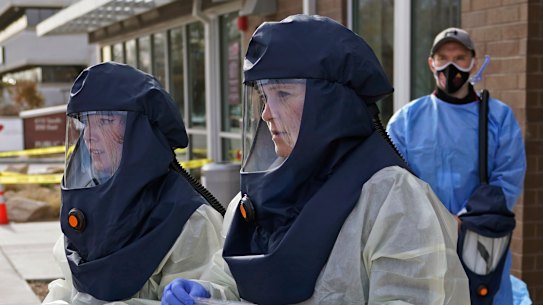 Public. health nurses perform COVID-19 tests in Salt Lake City, Utah.