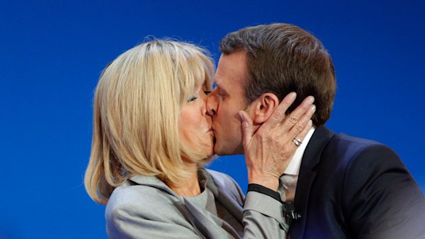 Macron kisses his wife Brigitte on election day in 2017.