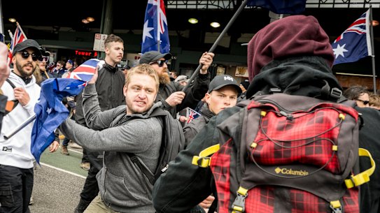 National Socialist Network members arrive at the ‘March for Australia’ rally today which turned violent as right wing groups, including the NSN, clashed with anti-fascist groups in Melbourne, Victoria.
