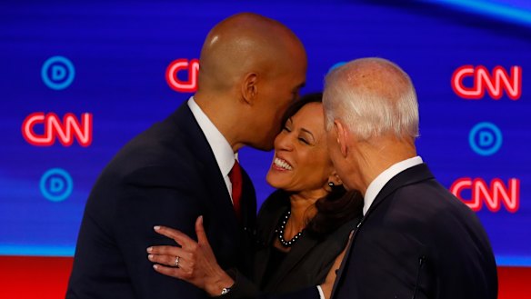 Cory Booker, Joe Biden and Kamala Harris talk after the second of two Democratic presidential primary debates.