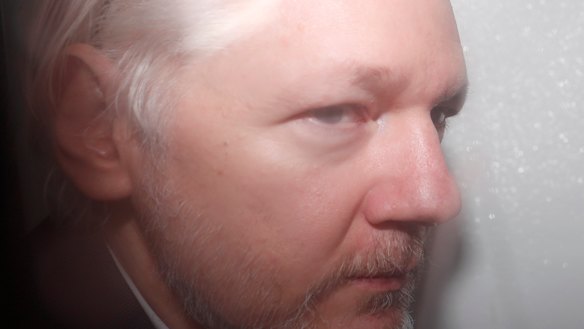 WikiLeaks founder Julian Assange is seen in a prison van travelling to Westminster Magistrates Court in London on December 20, 2019.