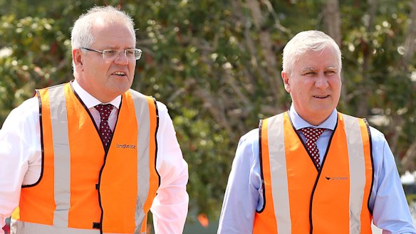 Prime Minister Scott Morrison and his deputy Michael McCormack in Brisbane. The PM says the extra infrastructure spending will deliver long term benefits.