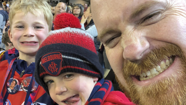 Neil Cahir has passed on his love of the Demons to sons Angus, 7, and Henry, 6.