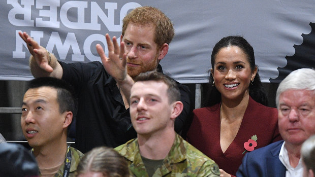 Prince Harry and Meghan watch the wheelchair basketball.