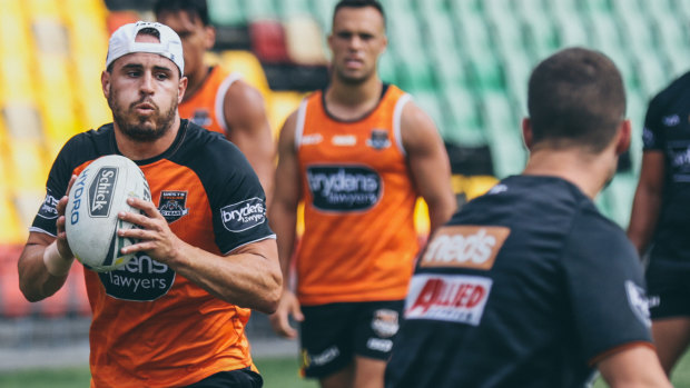 In the running: Josh Reynolds has some experienced competition for the five-eight role at the Tigers.