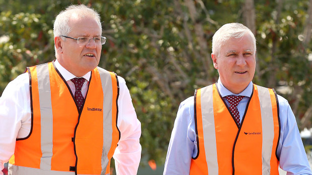 Prime Minister Scott Morrison and his deputy Michael McCormack in Brisbane. The PM says the extra infrastructure spending will deliver long term benefits.