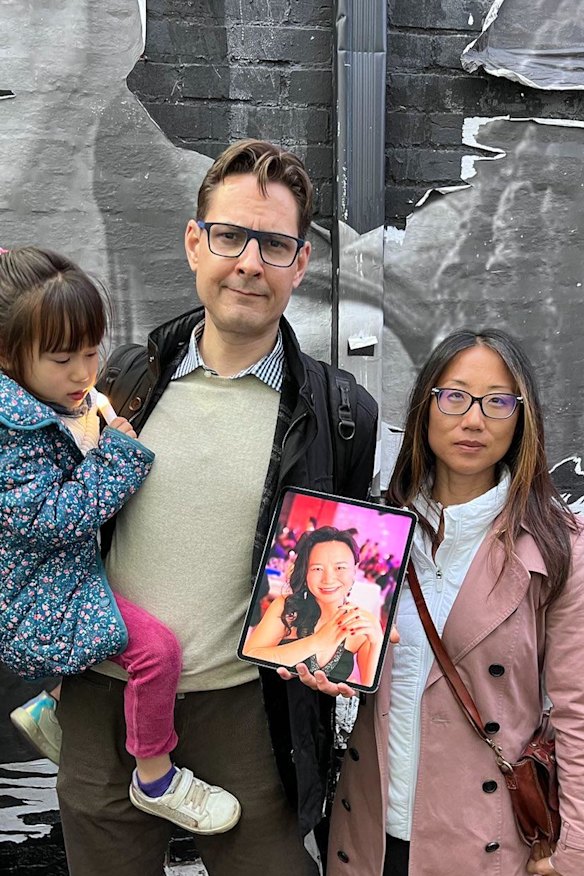 Canadian Michael Kovrig holding up a photo of Cheng Lei in Washington this week. 