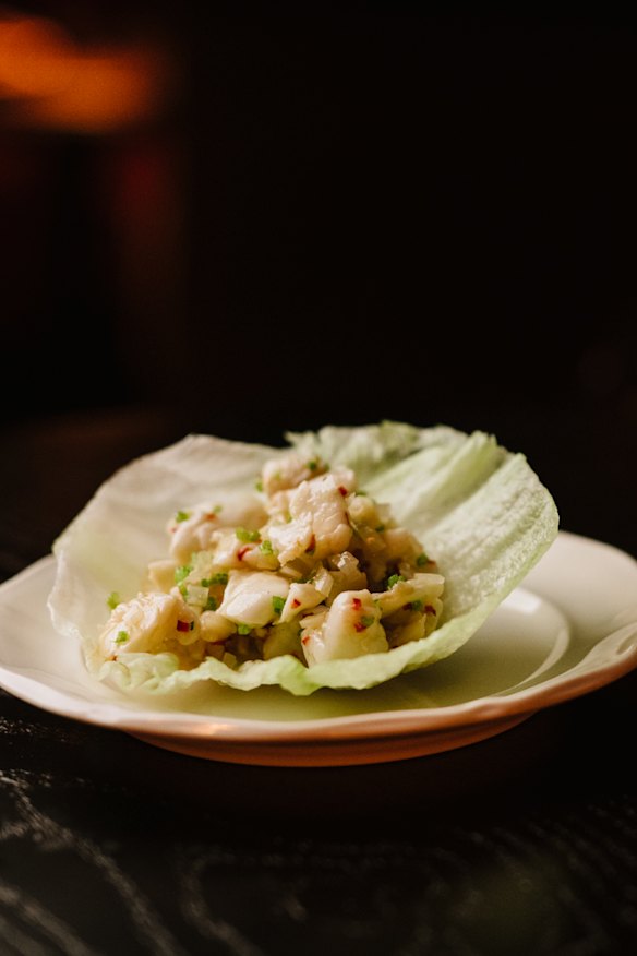 Painted tropical crayfish san choy bao with water chestnuts and coriander. 