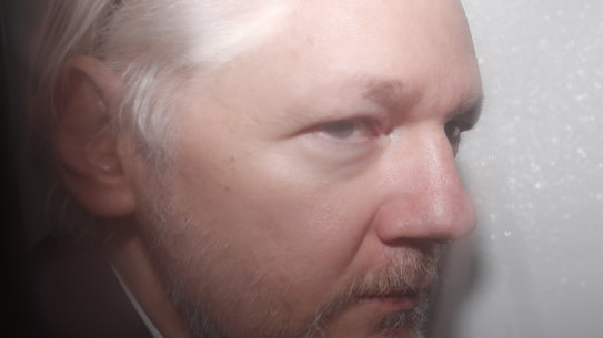 WikiLeaks founder Julian Assange is seen in a prison van travelling to Westminster Magistrates Court in London on December 20, 2019.