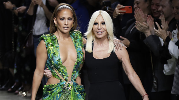 Actress Jennifer Lopez and designer Donatella Versace recreate the singer’s red carpet Grammy moment on the Milan runway in 2019.