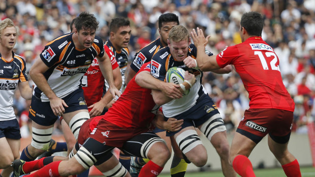 Front foot: Tom Cusack storms into the Sunwolves defence during a match in 2019. 