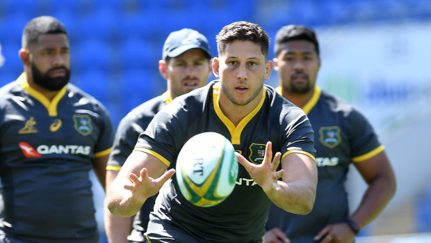 Pressure: Adam Coleman, receiving the ball at training, knows the Wallabies need to lift.