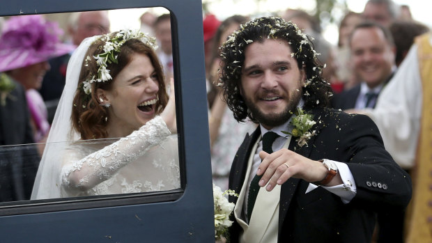 Actors Kit Harington and Rose Leslie react as they leave after their wedding ceremony, at Rayne Church, Kirkton of Rayne in Aberdeenshire, Scotland.