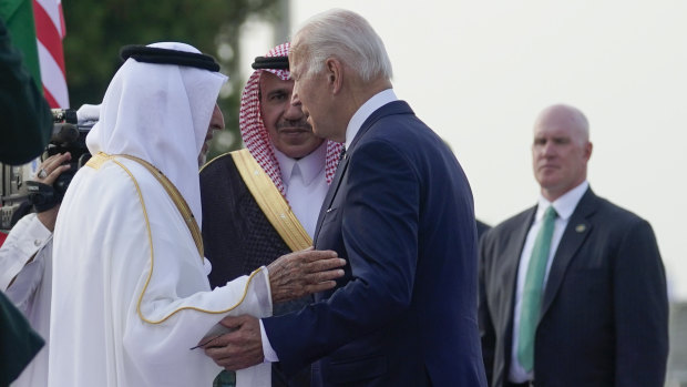 US President Joe Biden is greeted by officials as he arrives at King Abdulaziz International Airport in Jeddah, Saudi Arabia.