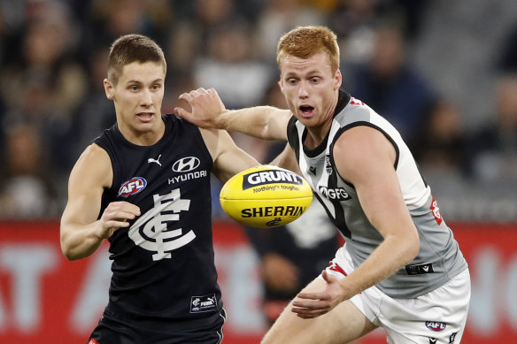 Carlton’s Lachie Fogarty vies with Port Adelaide’s Willem Drew.