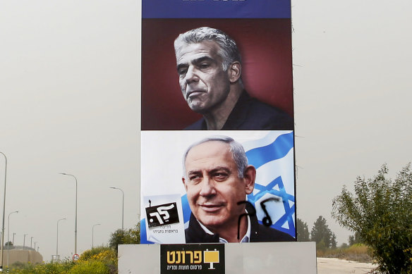 An election campaign billboard for Israeli Prime Minister Benjamin Netanyahu (bottom) and opposition candidate Yair Lapid prior to the March 23 election.